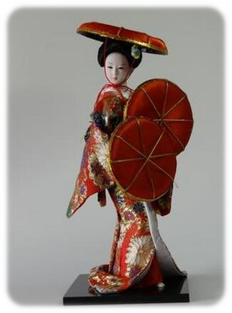 Doll Red Holding Three Hats